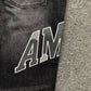 AMIRI VARSITY LOGO REPAIR JEANS