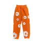 DENIM TEARS COTTON WREATH SWEATPANTS ORANGE