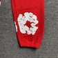 DENIM TEARS COTTON WREATH SWEATPANTS RED