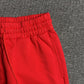 DENIM TEARS COTTON WREATH SWEATPANTS RED