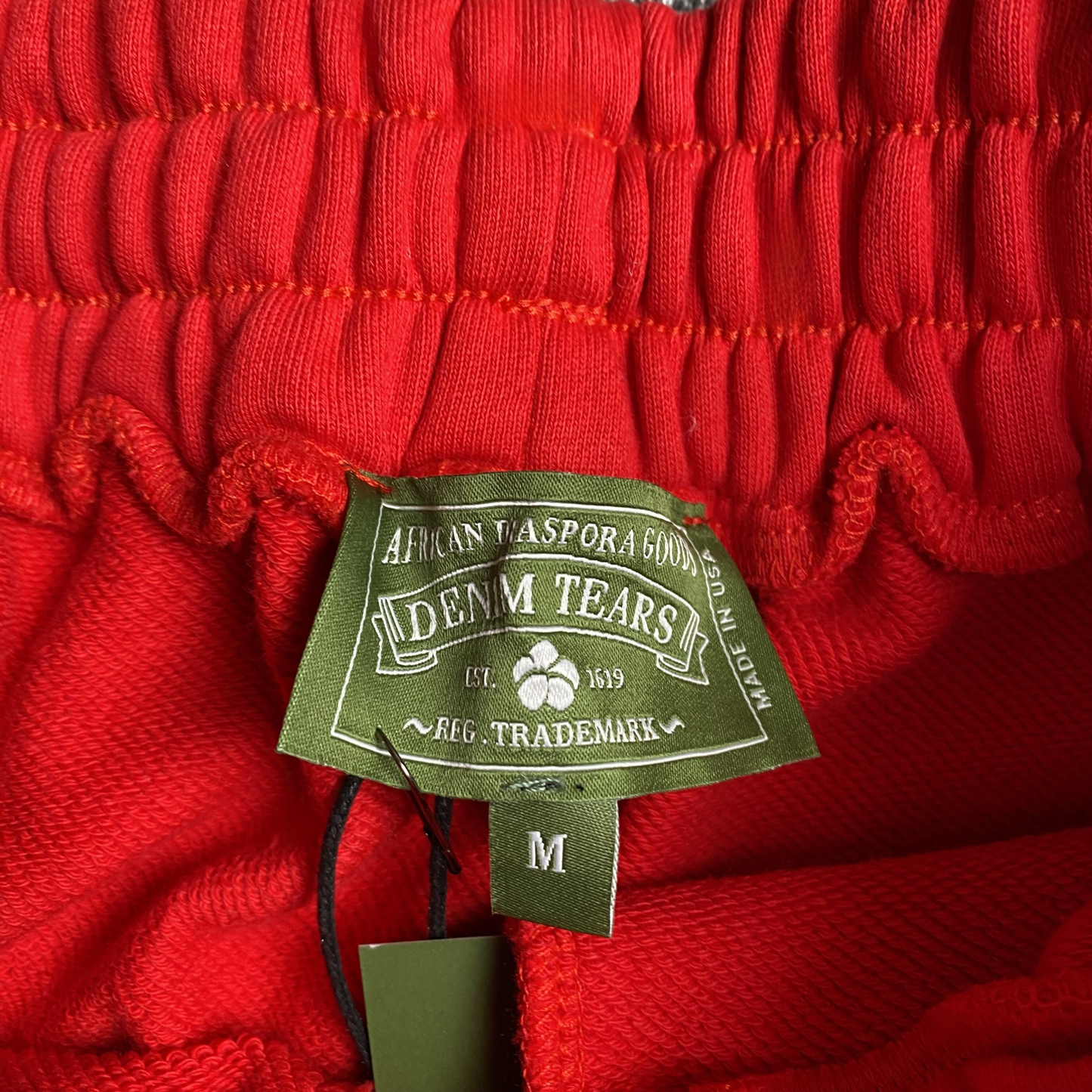 DENIM TEARS COTTON WREATH SWEATPANTS RED