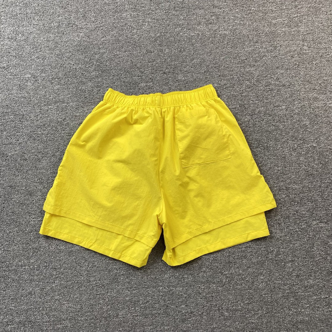SP5DER DOUBLE LAYER SHORTS YELLOW