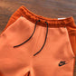 NIKE TECH FLEECE PANTS x CAMPFIRE ORANGE